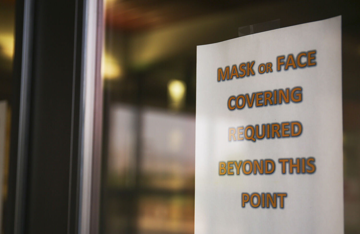 Signs reminding students and staff of the mask requirement